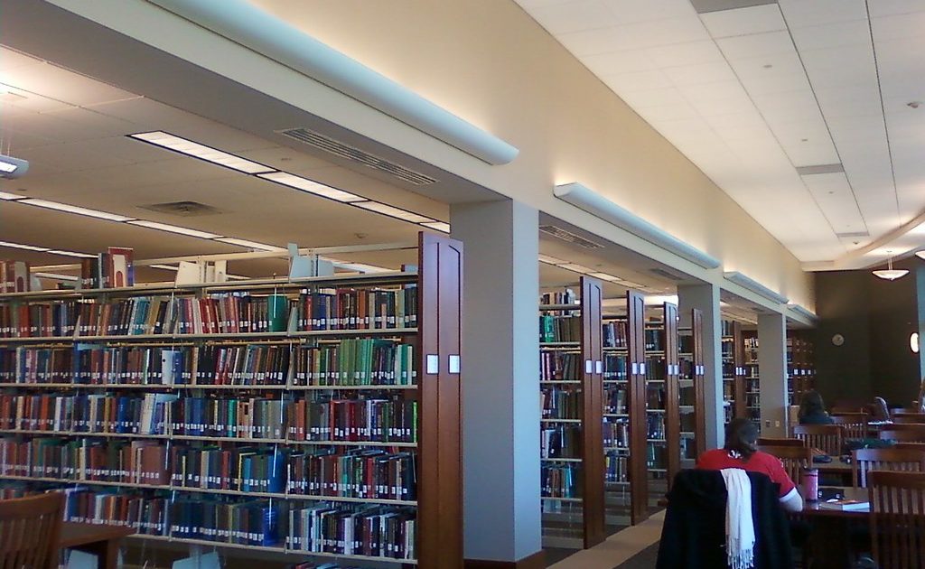 Books and a notebook on a desk