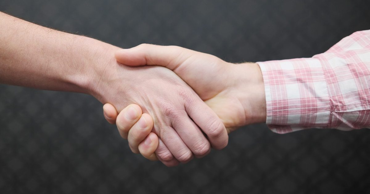 Corporate Handshake. A woman shaking a man's hand