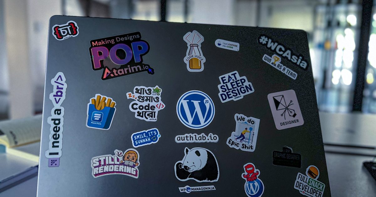 An open laptop on a wooden desk