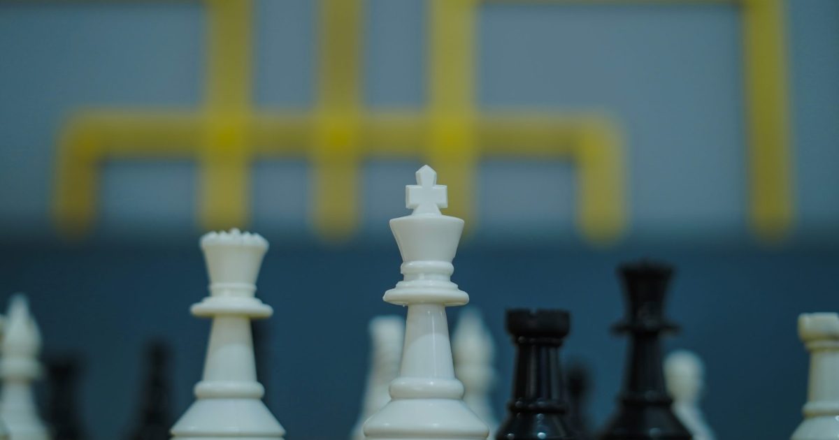 Chess pieces set up on a board