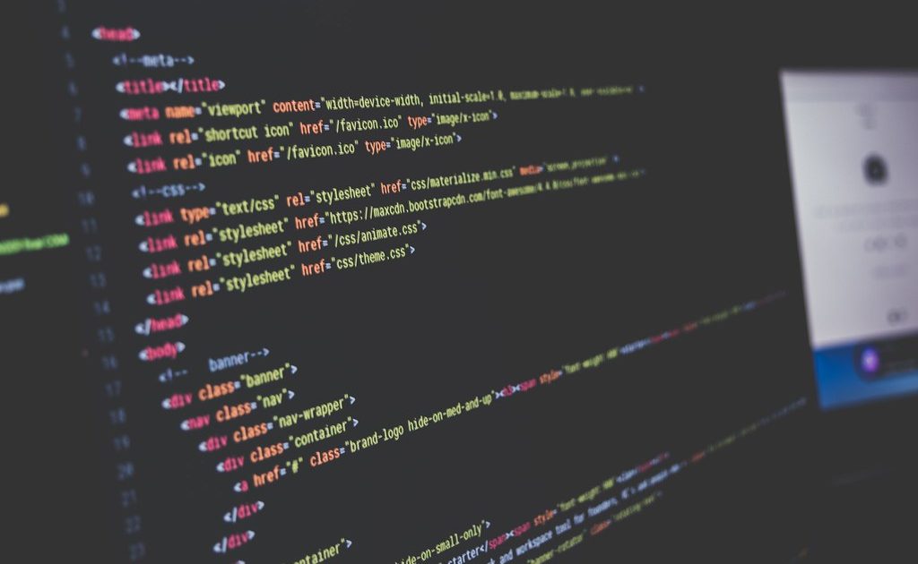 Lines of source code on a dark computer screen