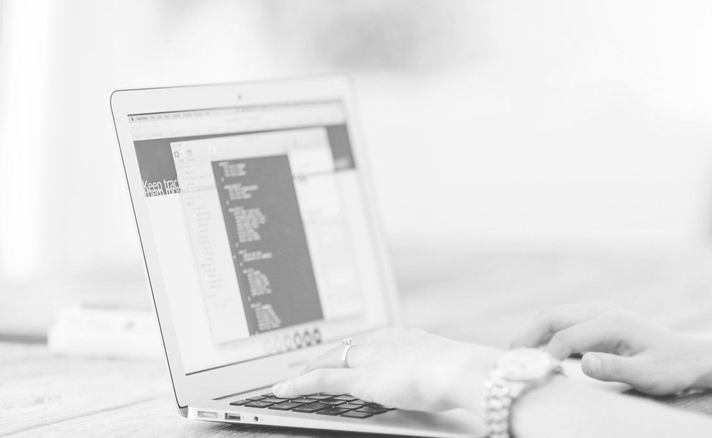 A code editor open on a laptop screen