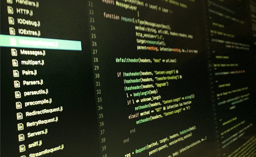 A code editor open on a laptop screen