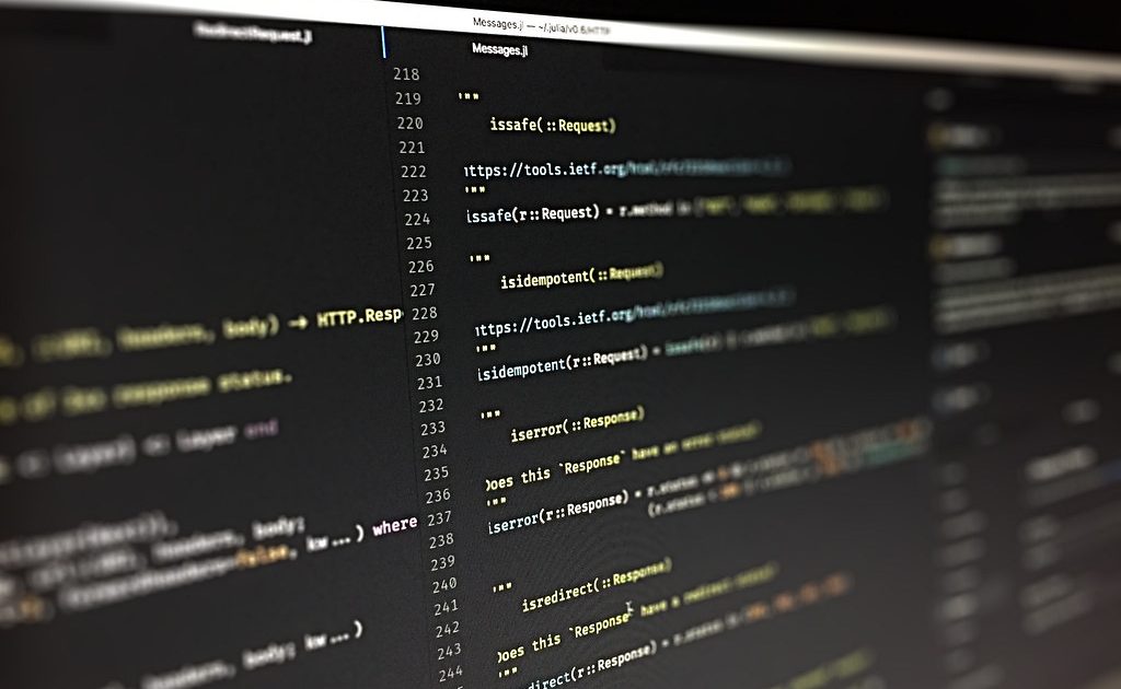 Lines of source code on a dark computer screen