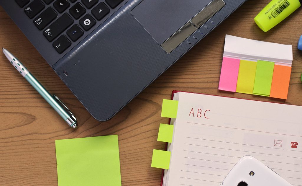 A pen and an open notebook ready for notes