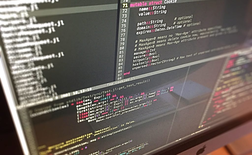A code editor open on a laptop screen