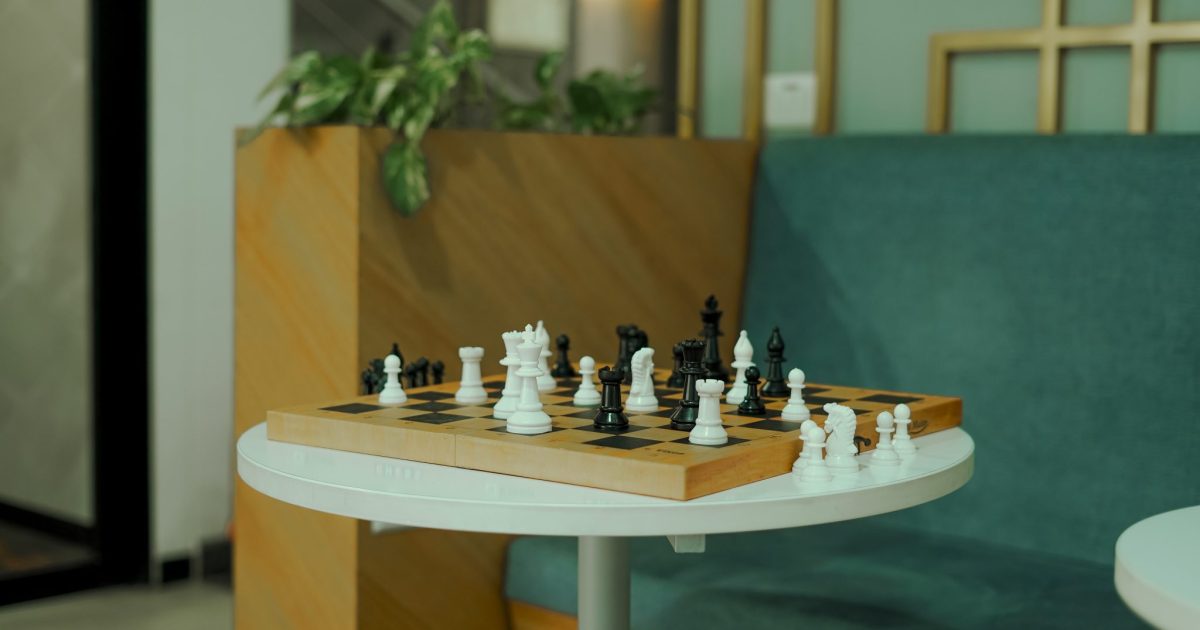Chess board placed on a white table