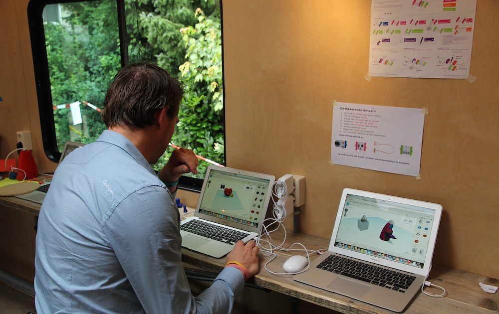 An open laptop on a wooden desk