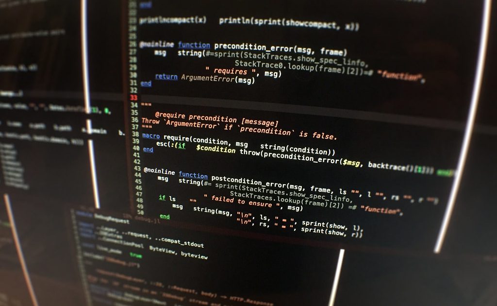 A code editor open on a laptop screen