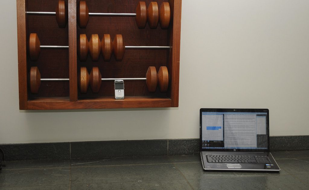 Books and a notebook on a desk