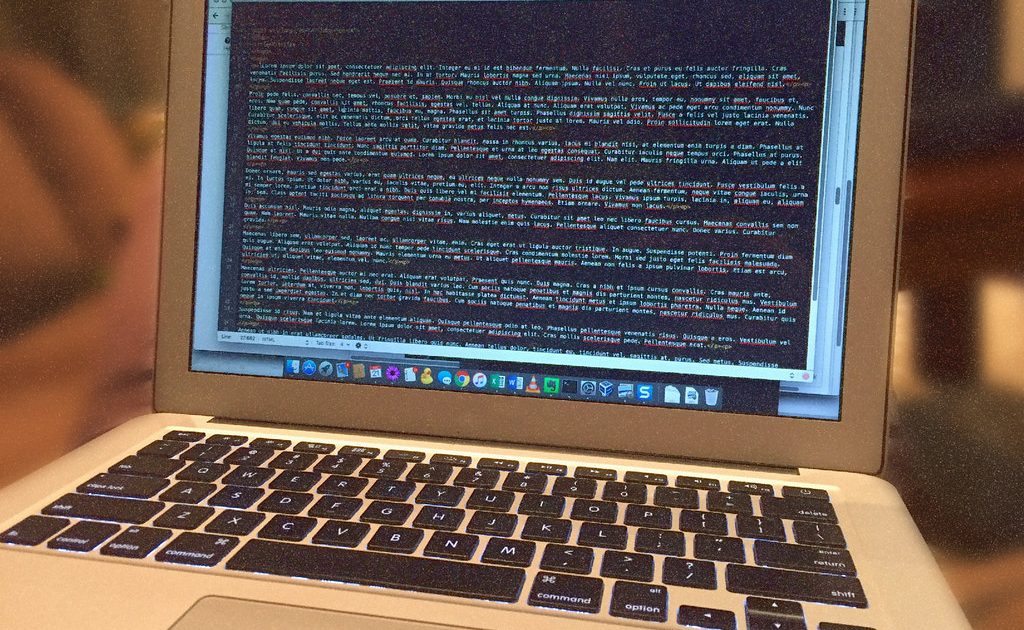 Lines of source code on a dark computer screen